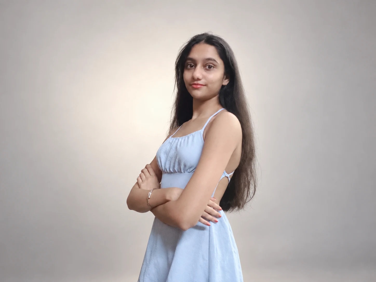 Sreejata turned to the side in her pale blue dress