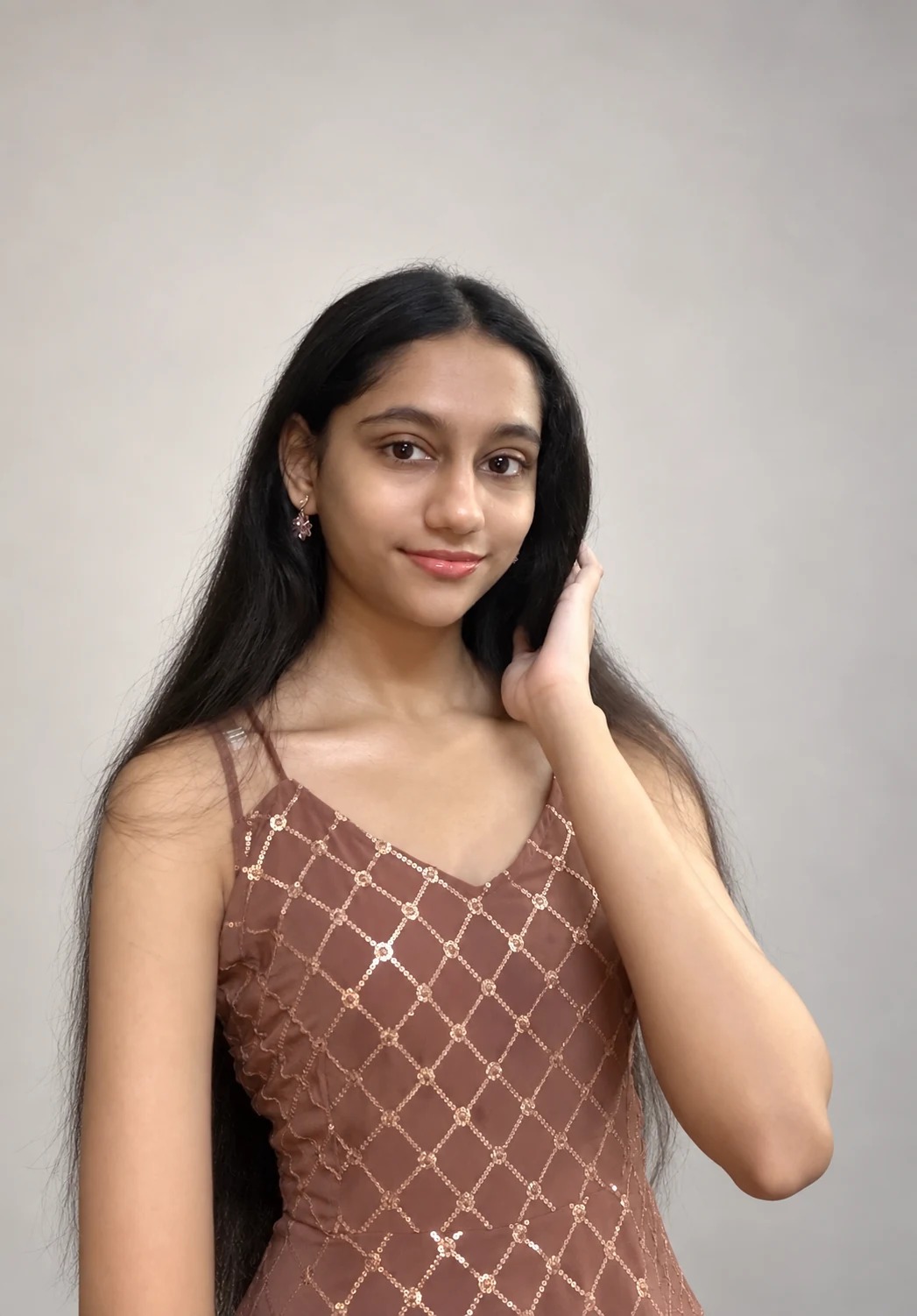 Sreejata in her brown patterned outfit in a studio portrait