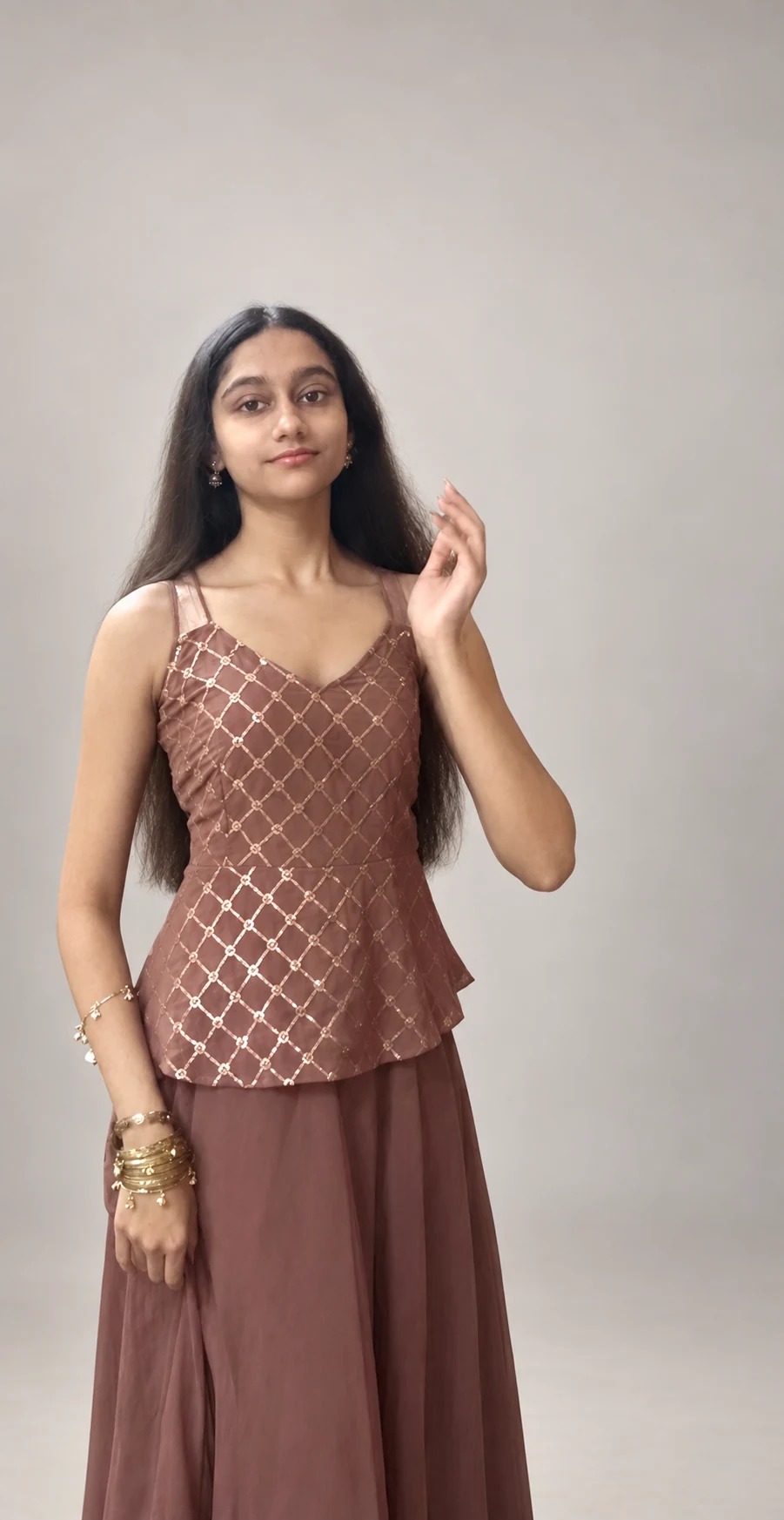 Sreejata in her brown outfit, with her original pose preserved